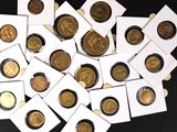 a pile of coins sitting on top of a black table