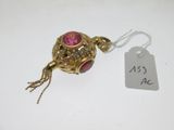 a close up of a necklace with a tag attached to it
