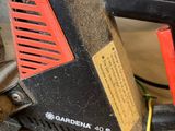 a picture of a chainsaw that is sitting on the ground