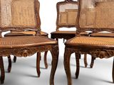 four antique chairs with cane back and cane legs