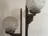 a lamp that is sitting on a stand in a room