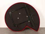 a black and red table with a red frame on top of it