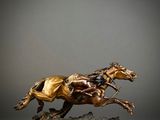 bronze statue of a horse and rider on a marble base