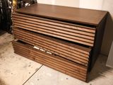 a picture of a wooden chest of drawers in a room