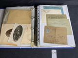 an old book with a lot of old papers on it