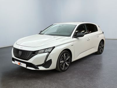 a white car in a white room with a black floor