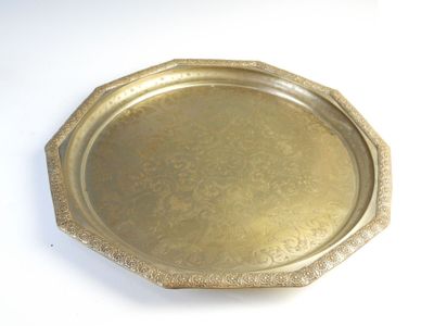 a gold tray on a white table with a white background