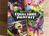 a close up of a box of pokemon cards on a table