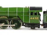 a toy train that is sitting on a white surface