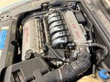 a picture of a car engine with its hood open