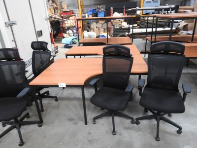 several chairs and a table in a room with a lot of furniture