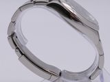 a close up of a watch on a clear stand