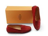 a pair of red sued shoes with a box on the side