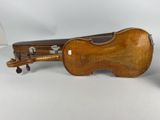 an old violin with a case on the back of it