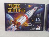 two boxes with a model of a space shuttle on them