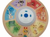 a wooden clock that has many different kinds of animals on it