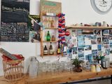 a wooden table with a bunch of bottles and glasses on it