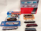 a lot of toy trains that are sitting on a table