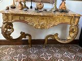 a table with a mirror and a candle on it