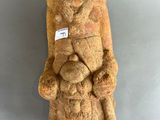 statue of a man holding a baby in his arms