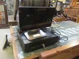 a laptop computer sitting on top of a wooden table
