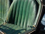 a close up of a car seat with a surfboard in the back