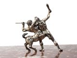 a statue of a man wrestling with a horse on a table