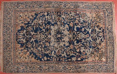 an antique persian rug with a floral design on a red ground