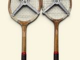 two tennis racquets that are on top of each other