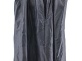 black skirt hanging on a hanger against a white wall
