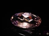 an image of a purple diamond on a black surface