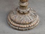 an image of a vase with flowers on a pedestal