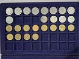 a purple box with a bunch of coins in it