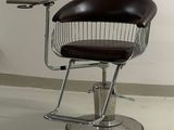 a chair and table in a room with a white wall
