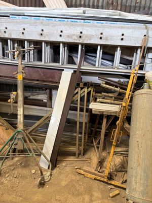 a pile of assorted metal items in a warehouse