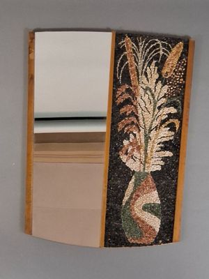 a picture of a mirror with a vase of flowers on it