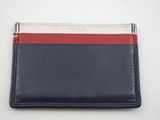 un portefeuille bleu et rouge avec une bande blanche sur le devant