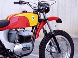 a red and yellow motorcycle parked in a parking lot