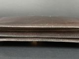 an image of a leather wallet with a zipper on it
