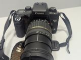 a camera with a strap attached to it sitting on a table