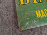 a green sign with yellow letters on it