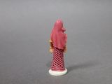 a small figurine of a woman wearing a hijab