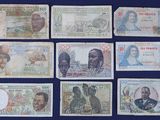 six different bank notes of different countries on a blue background