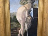 an oil painting of a nude woman with long hair in a gold frame