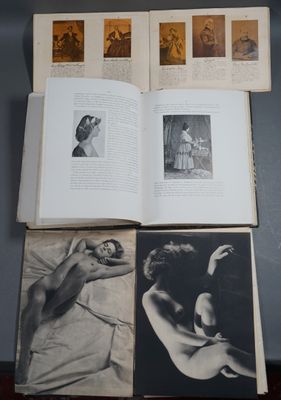 an open book sitting on top of a wooden table next to pictures