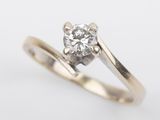 a close up of a diamond ring on a white background