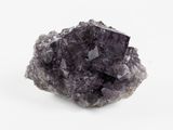 un gros plan sur un morceau de roche avec un petit morceau de roche au milieu