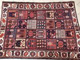 a close up of a rug on a tiled floor