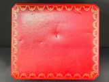 a red box with a gold design on it