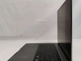 an open laptop computer sitting on top of a white table